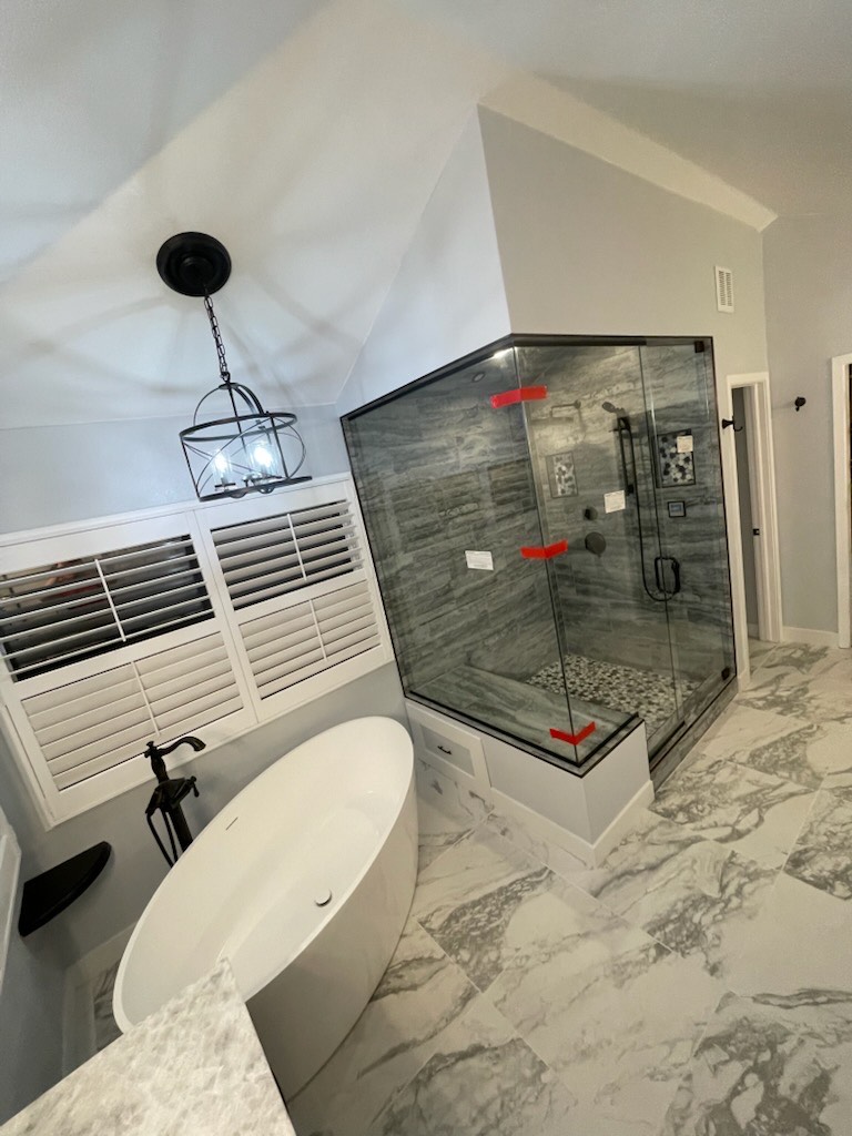 Luxury steam shower with freestanding tub and custom tile work