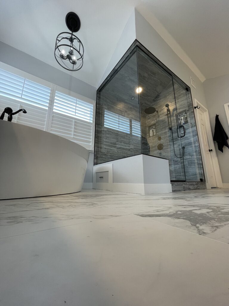 Luxury steam shower with freestanding tub and custom tile work in Broomfield Colorado