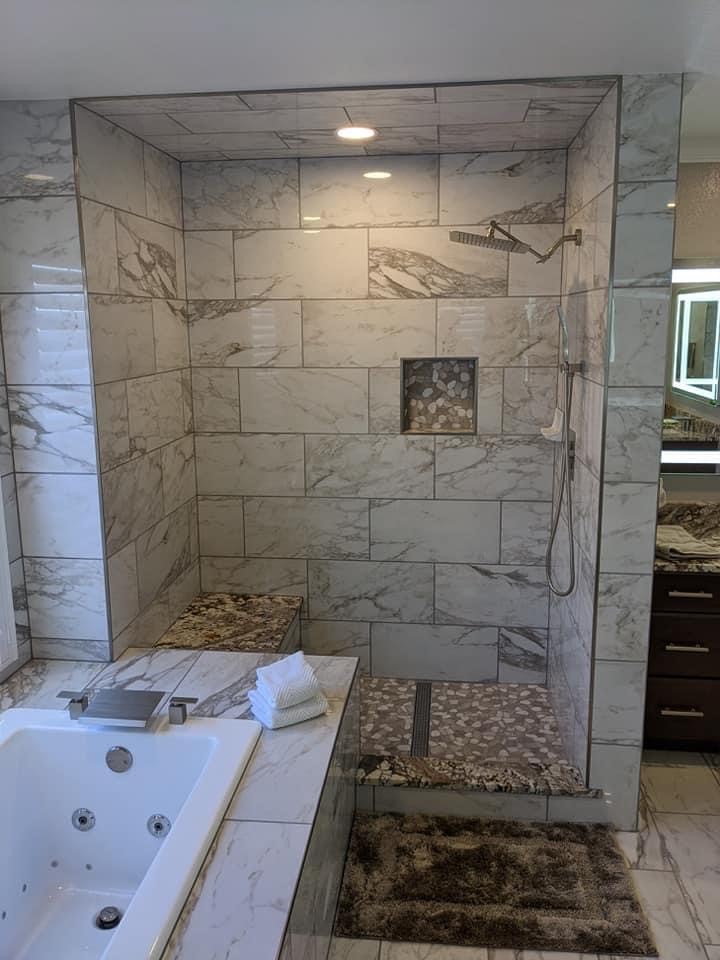 Bathroom remodel in Northglenn CO with custom shower, tub deck, and modern tile
