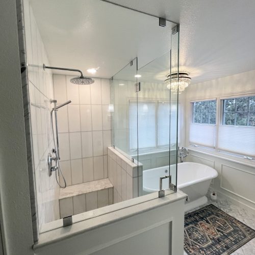 Bathroom remodel in Westminster Colorado with heated tile floor, marble tile, shower and tub