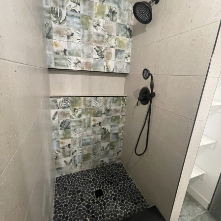 Custom tile shower in Thornton Colorado with full width infinity niche and detailed tile work
